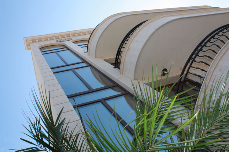 The facade of Palazzo Byala: stone arches and wrought iron